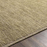 Close-up of the hand-loomed Magpet Area Rug. Olive green wool rug with a subtle textured, contemporary design. Texture