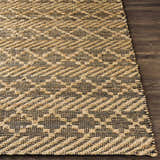 Close-up of the hand woven Malidong Jute Carpet. Black and tan geometric pattern on a jute rug. Farmhouse style. Front