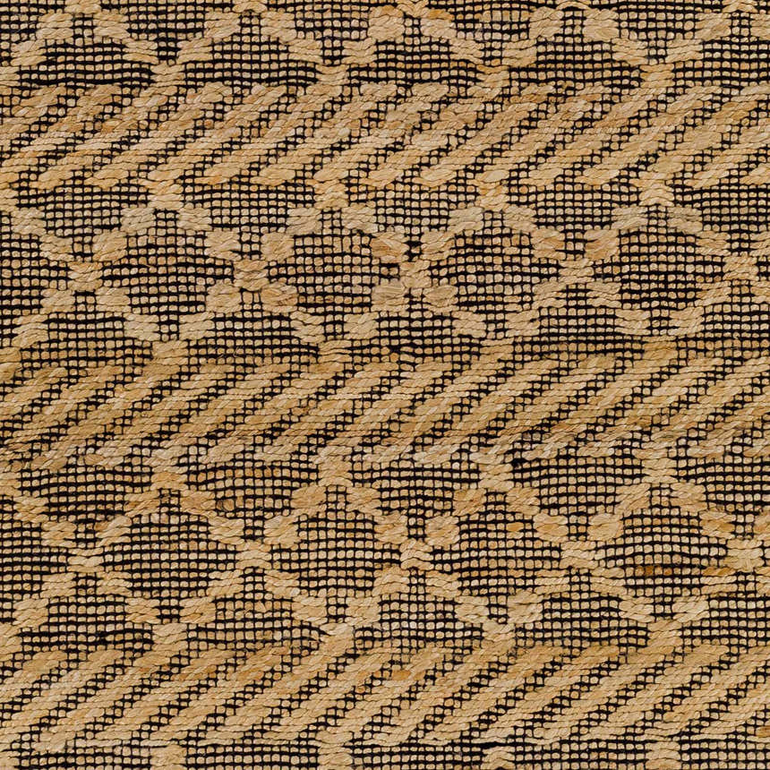 Close-up of the Malidong Jute Carpet showing a geometric pattern in tan jute on a black woven background. Swatch