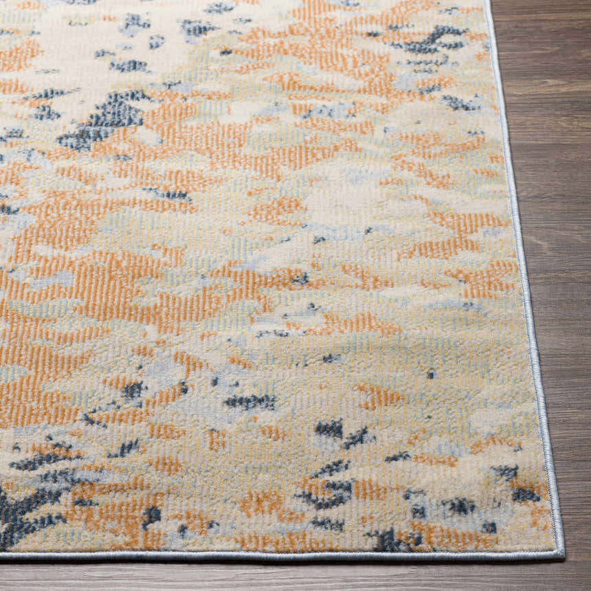 Close up of the Mallow Area Carpet showing its beachhouse, camel, and dark gray colors. Front