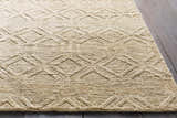 Close-up of the beige Manchester Clearance Jute Rug, featuring a raised diamond pattern and natural fiber texture. Styleshot