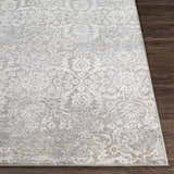 Close-up of the Mandurah Area Rug showing its traditional charcoal, cream, and gray oriental pattern and soft texture. Front