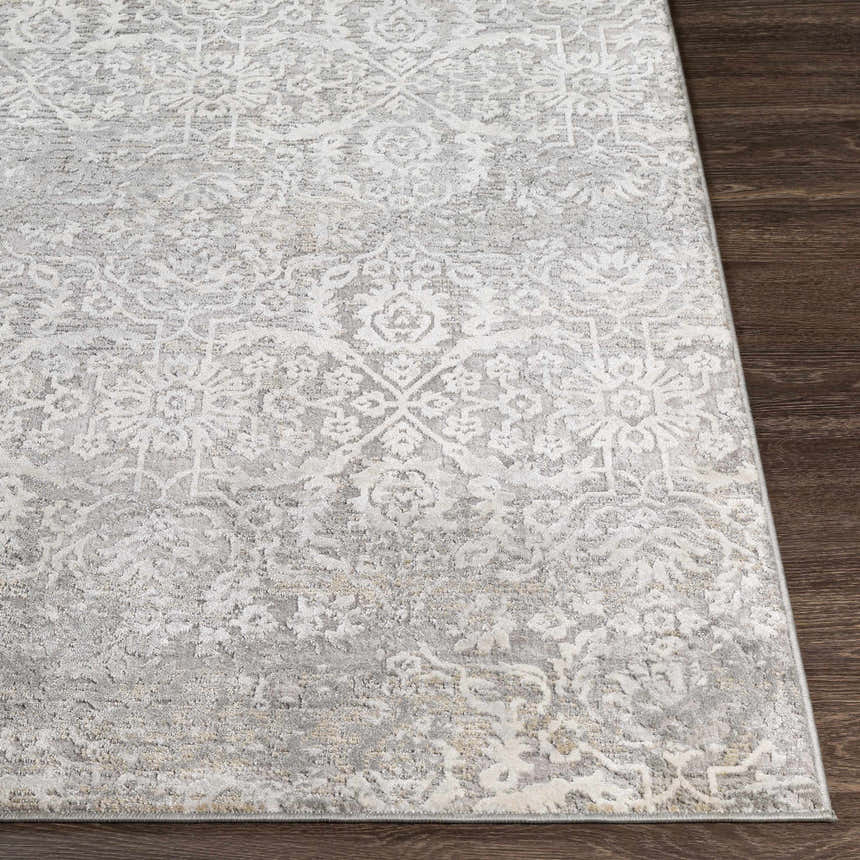 Close-up of the Mandurah Area Rug showing its traditional charcoal, cream, and gray oriental pattern and soft texture. Front