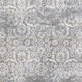 Close-up of the Mandurah Area Rug. Charcoal gray rug with cream and light beige traditional floral pattern. Swatch