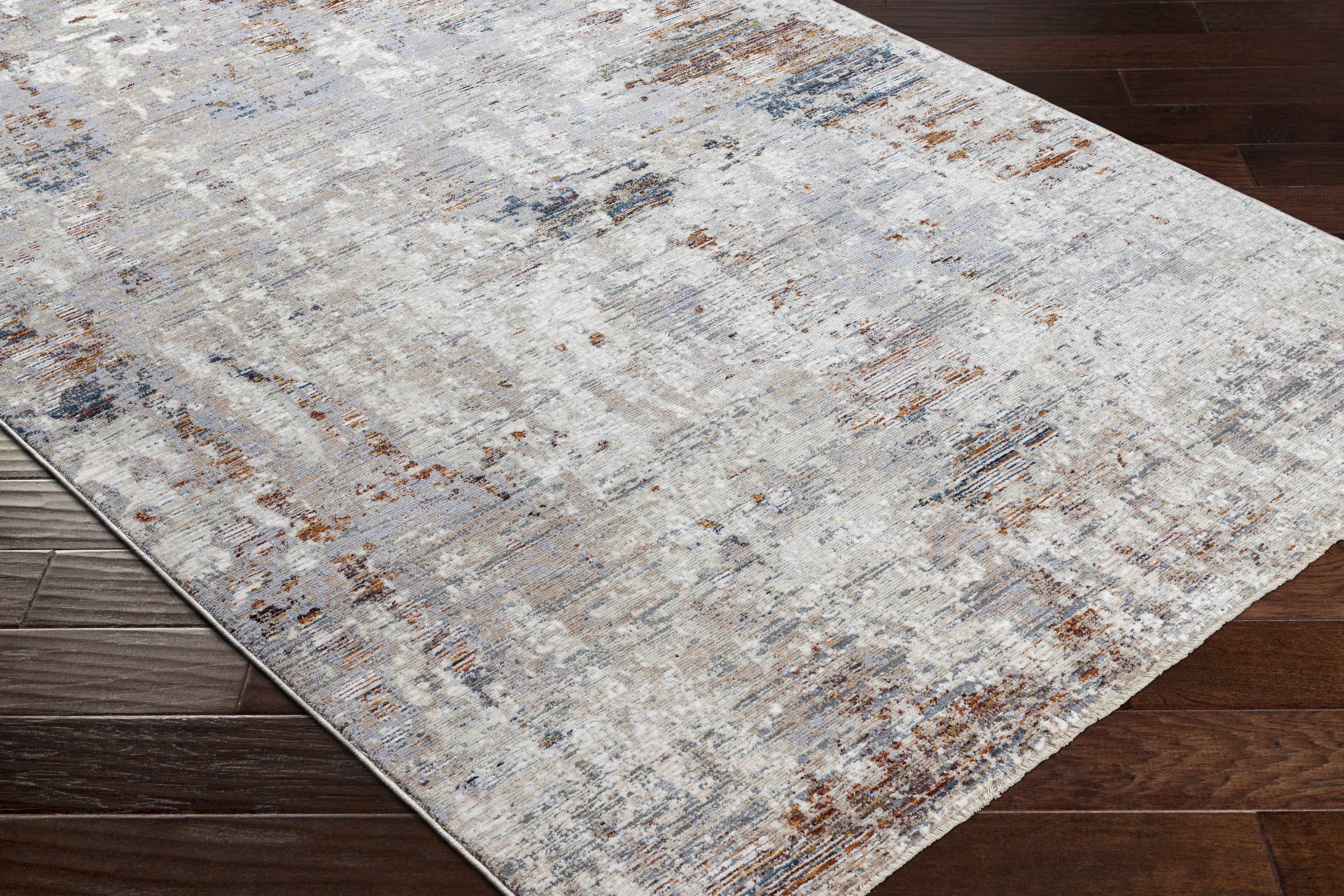 Zoomed-in view of the edge of Mangili Area Rug - Clearance, focusing on border details and craftsmanship. Traditional Area Rug Backing  