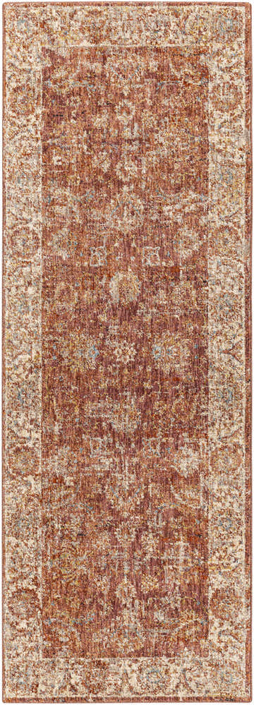 Close-up of the Maniwaki Area Rug. Features brick red, light beige, and charcoal colors in a traditional, distressed pattern. Design-Runner-2773