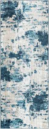 Close-up of the Masiga Washable Area Rug. Features a contemporary abstract pattern in shades of blue and beige. Design-Runner-2773