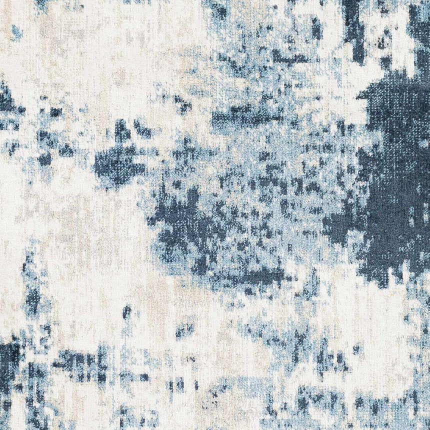 Close-up of the Masiga Washable Area Rug featuring a contemporary abstract design in shades of blue and white. Swatch