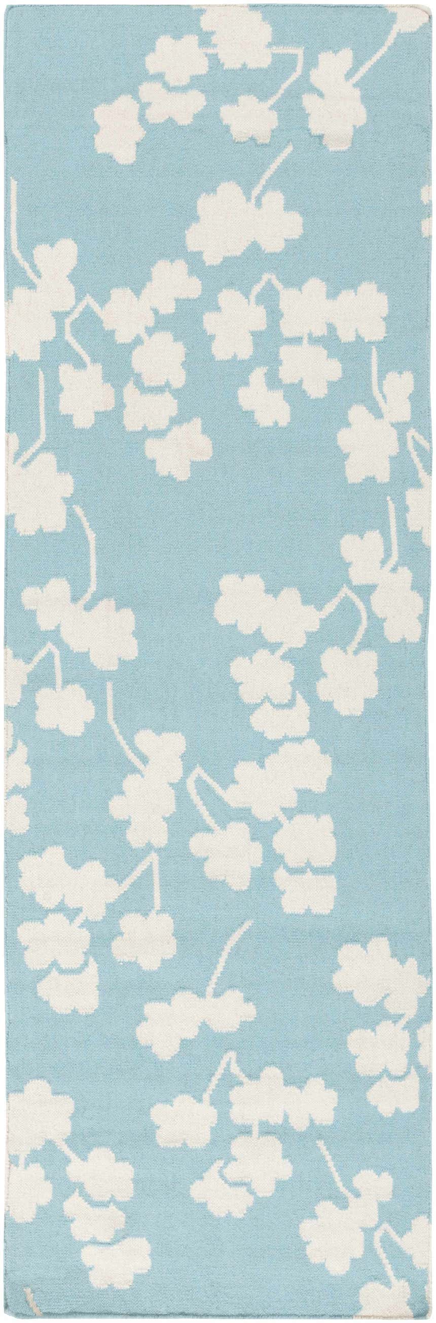 Close-up of the Matador Area Carpet: Aqua wool rug with a light beige floral branch pattern. Hand-woven texture. Design-Runner-268