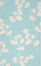 Close-up of the Matador Area Carpet. Aqua wool rug with a light beige floral pattern. Hand woven. Design-Rectangle-58