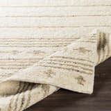Close-up of the ivory Matawan Premium Wool Rug with a horizontal striped pattern and hand-woven texture. Fold