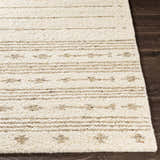 Close-up of a hand-woven Matawan Premium Wool Rug. Cream rug with brown stripes and geometric shapes. Wool texture. Front