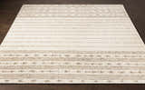 Close-up of the Matawan Premium Wool Rug. Ivory rug with brown stripes and geometric pattern. Hand-woven texture. Front