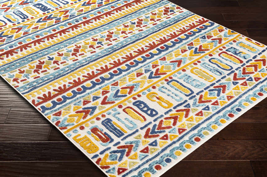 Close-up of the Maxie Area Rug showcasing its aqua, blue, red, and yellow contemporary geometric design. Corner