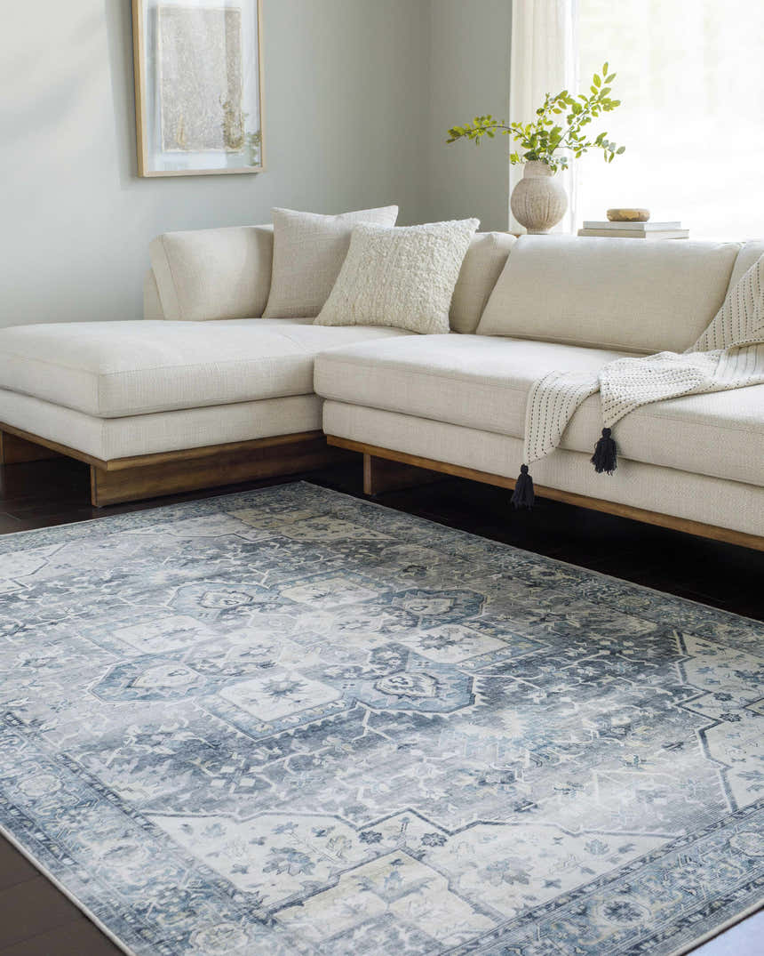 Living room scene with a light gray sectional sofa and Mauro Blue Medallion Washable Area Rug. Roomscene-Rectangle