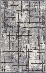 Close-up of the Mace Area Rug - Clearance. Charcoal, cream, and slate rug with a contemporary grid pattern. Design-Rectangle-537