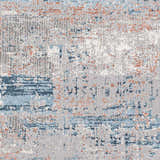 Close-up of the McCracken Area Rug featuring a contemporary abstract design with blue, gray, and orange tones. Swatch