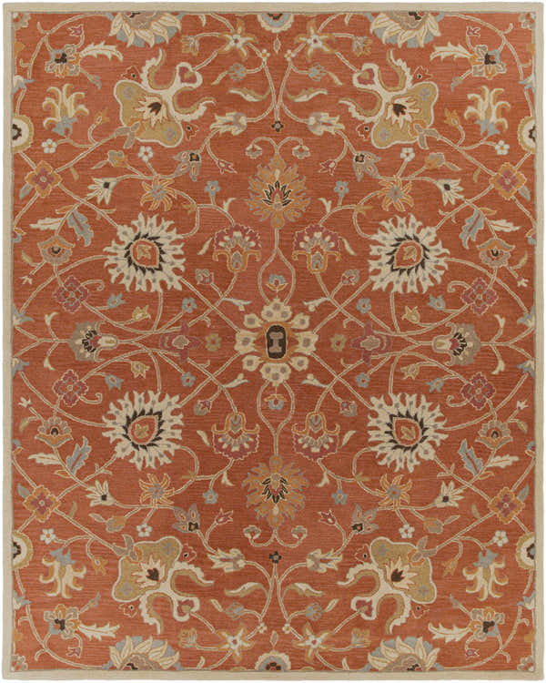 Close-up of the Logville Hand Tufted Rust 1119 Wool Rug. Features a traditional floral pattern in rust, cream, and blue tones. Design-Rectangle-7696