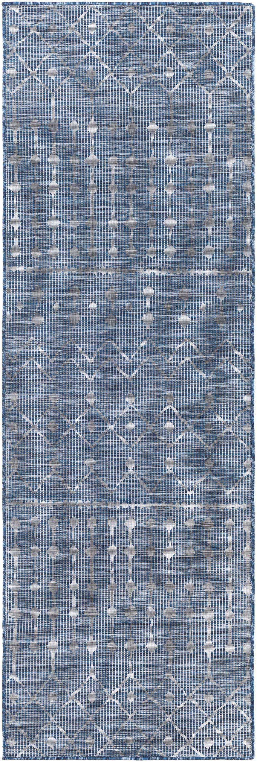 Close-up of the Maddingley Flatweave Area Carpet. Blue and dark blue geometric pattern, machine woven texture. Design-Runner