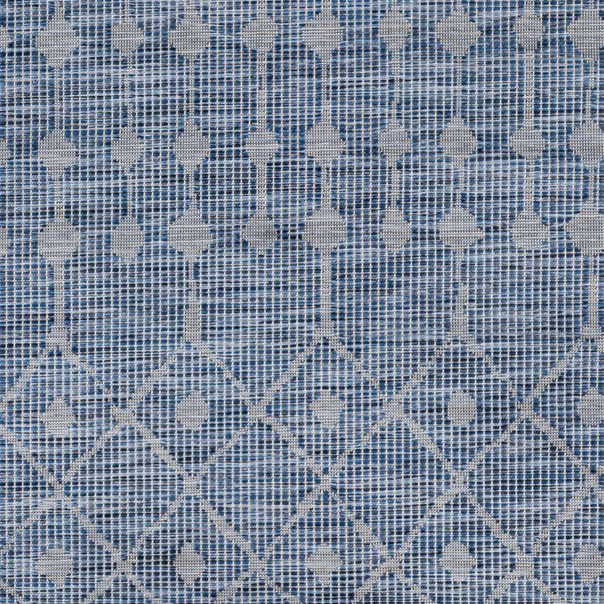 Close-up of the Maddingley Flatweave Area Carpet. Features a blue geometric pattern on a textured flatweave. Swatch