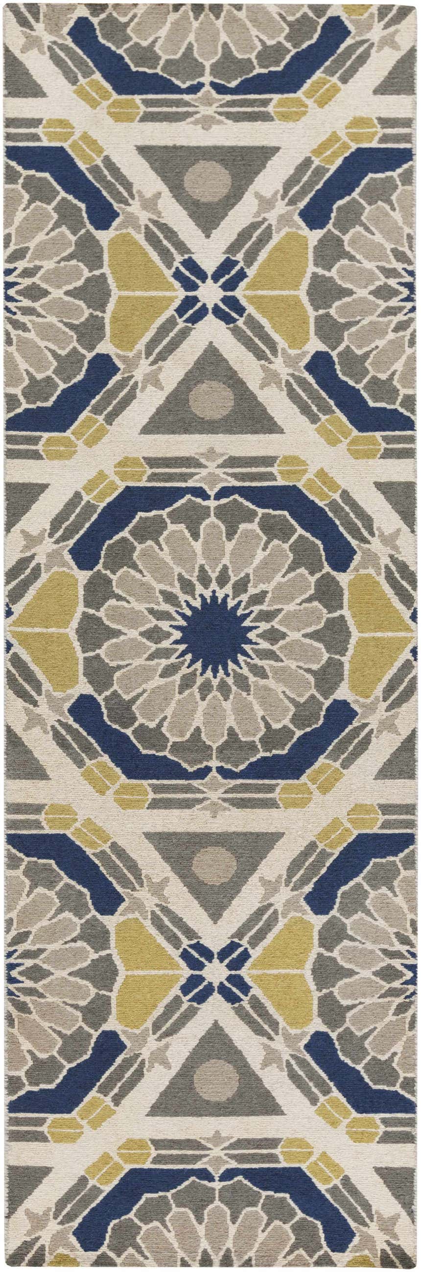 Close-up of the Mesena Area Rug. Hand-knotted wool rug in ivory, light gray, navy, and tan with a geometric pattern. Design-Runner-268