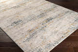 Close-up of the Midhurst Luxe Rug. Contemporary design in cream, gray, teal, and mustard colors. Abstract pattern. Corner