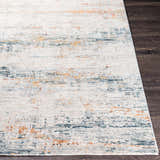Close-up of the Midhurst Luxe Rug, a contemporary rug with brick red, teal, and cream abstract pattern. Front