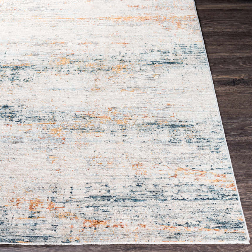 Close-up of the Midhurst Luxe Rug, a contemporary rug with brick red, teal, and cream abstract pattern. Front