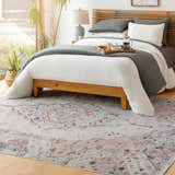 Bedroom scene with a Brick Red and Gray Midtown Washable Area Rug under a light wood bed with gray and white bedding. Roomscene-Rectangle