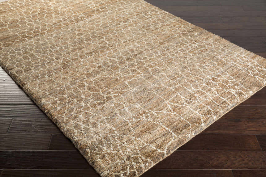 Close-up of the beige and black Milbridge Clearance Jute Rug showing its hand-knotted texture and contemporary pattern. Corner