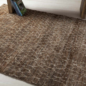 Close-up of the beige and brown Milbridge Clearance Jute Rug, featuring a subtle geometric pattern and textured weave. Styleshot