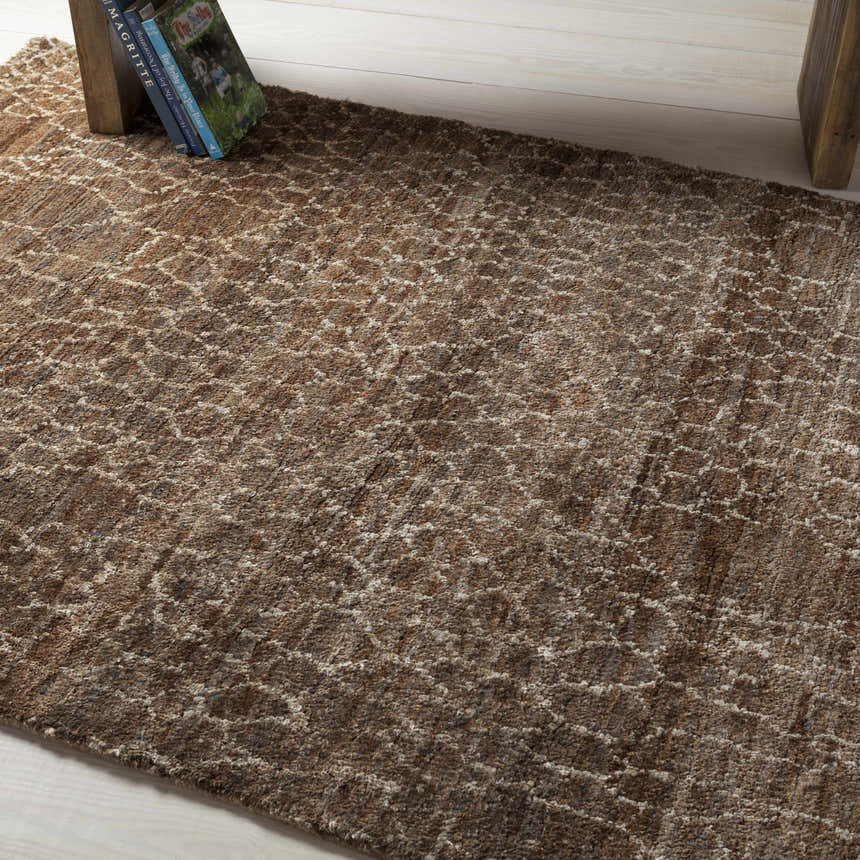 Close-up of the beige and brown Milbridge Clearance Jute Rug, featuring a subtle geometric pattern and textured weave. Styleshot