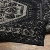 Close up of the black and cream Minapan Premium Area Rug showing the traditional hand-knotted design. Fold