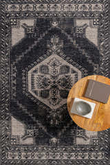 Close-up of the Minapan Premium Area Rug in black and cream, showcasing its traditional, hand-knotted design and geometric patterns. Styleshot