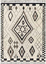 Close-up of the Minyama Area Rug. Hand-knotted wool rug with black, charcoal, cream, and gray geometric diamond pattern and tassels. Design-Rectangle-810