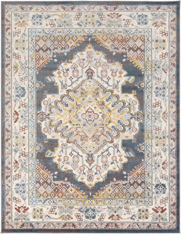 Close-up of the Millican Area Rug. Bohemian style rug with blue, brown, garnet, and gray floral and geometric patterns. Design-Rectangle-710103