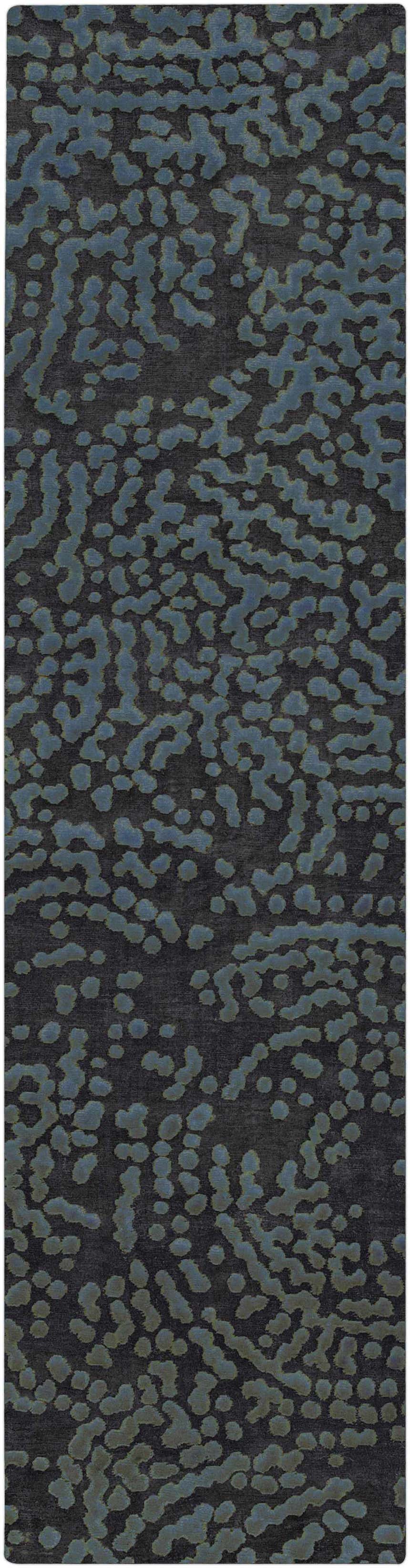 Close-up of the Pensacola Denim/Black Rug, featuring a contemporary abstract pattern in denim blue on a black background. Design-Runner-2610