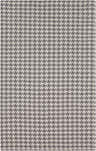 Close-up of the Moab Carpet, a hand-woven wool rug with a charcoal and light gray houndstooth pattern. Design-Rectangle