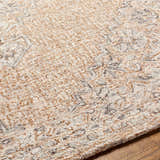 Close up of the Modimolle Area Carpet, a hand-tufted rug with brown, camel, and gray Persian-inspired patterns. Texture