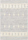 Close-up of the hand woven Moe Area Rug. Features a blue and cream diamond pattern with textured details. Design-Rectangle-576