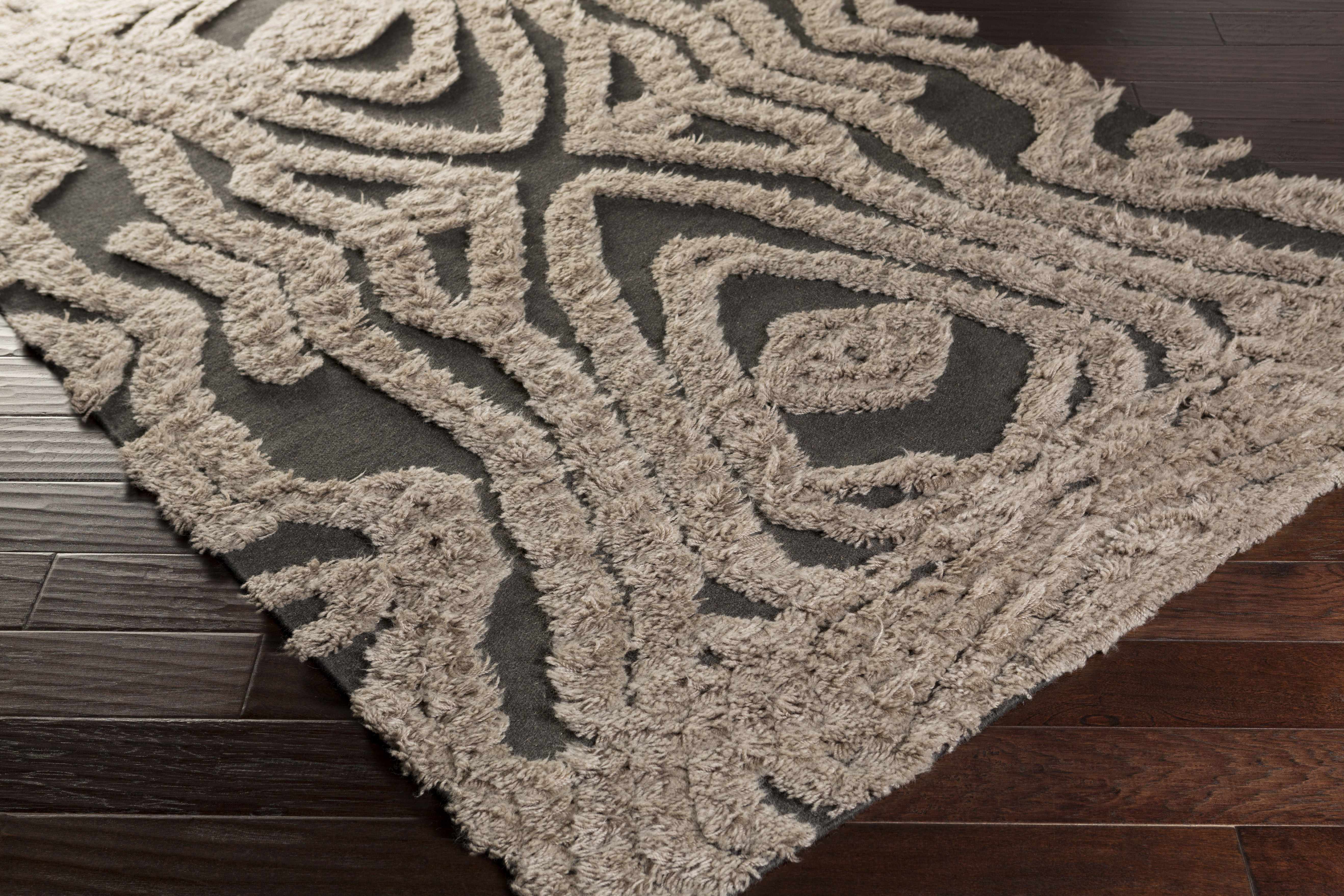 Zoomed-in view of the edge of Money Area Carpet - Clearance, focusing on border details and craftsmanship. Natural Fibers Area Rug Backing  