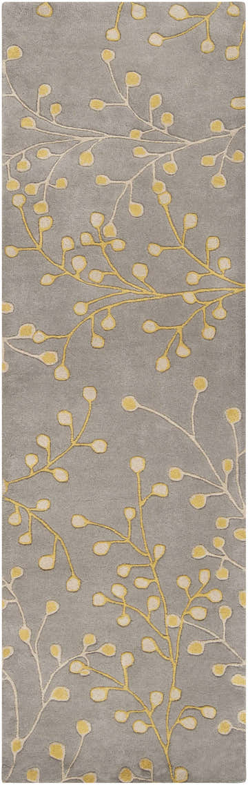 Close-up of the Elsu Mustard Wool Area Rug showing the floral branch pattern in mustard and taupe on a charcoal background. Design-Runner-268