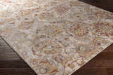 Close-up of the Morinville Area Rug showing its brick red, charcoal, and light beige traditional pattern. Corner