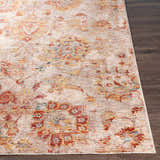 Close-up of the Morinville Area Rug showing its brick red, charcoal, and light beige traditional pattern. Front