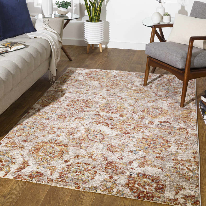 Living room scene with a brick red and beige Morinville Area Rug, sofa, and chair. Roomscene-Rectangle