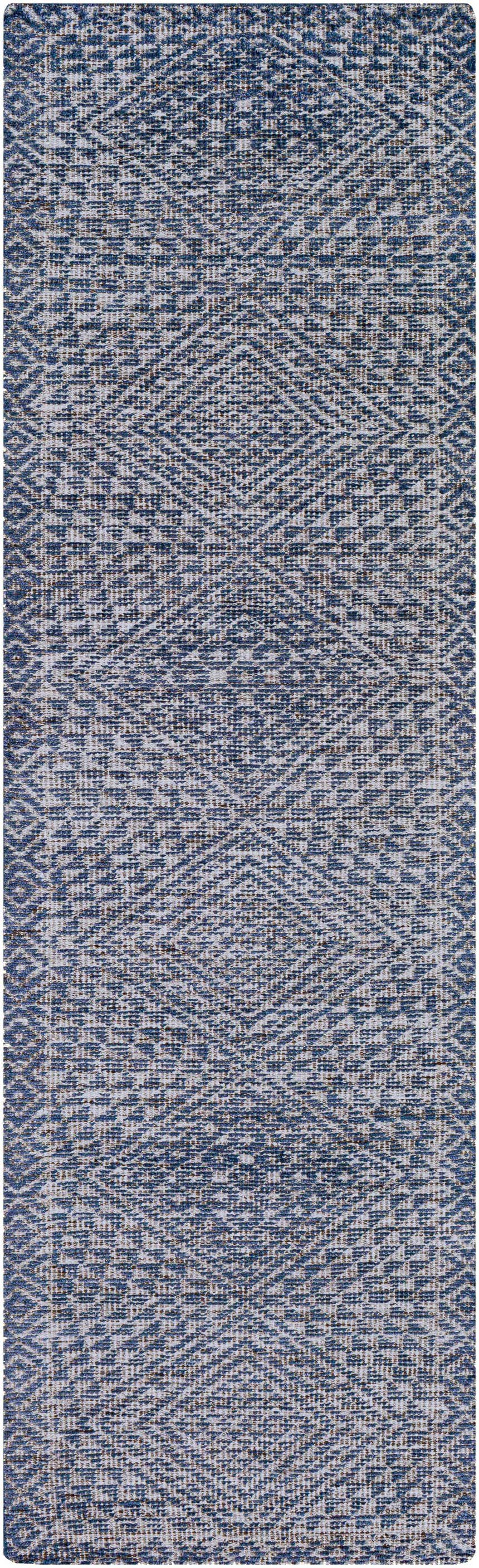 Close-up of the Moyne Area Rug: a hand-knotted rug with a geometric pattern in charcoal, navy, and white viscose. Design-Runner-268