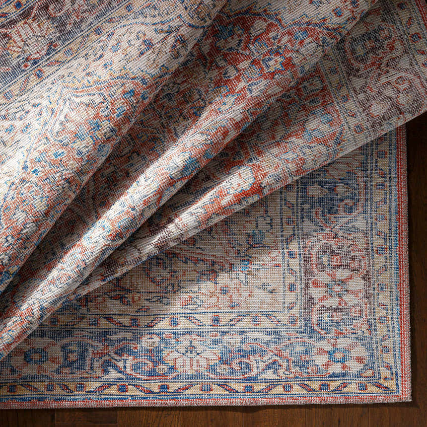 Close-up of Cream Rust Maribojoc Medallion Washable Area Rug showing its oriental, traditional design and chenille-polyester texture. Fold