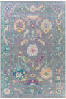 Detailed view of the Marchwood Area Rug, a hand-knotted wool rug with blue, pink, and gray floral bohemian pattern. Design-Rectangle-69