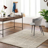 Home office with a light brown Maro Area Rug, wood desk, gray chair, and dark wood floors. Roomscene-Rectangle