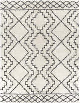 Close-up of the Mooroolbark Area Rug. Ivory shag rug with a black geometric diamond pattern. Perfect for bathroom or kitchen. Design-Rectangle-71010